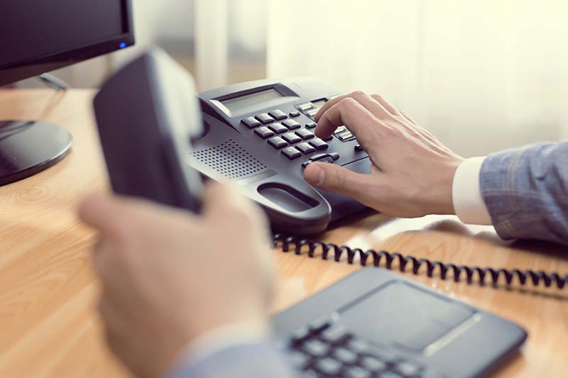 VoIP internet phone technology demonstration showing modern communication setup and digital telephony equipment.